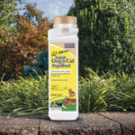 Bonide Go Away! repellent bottle placed outdoors on a stone edge with plants and trees in the background