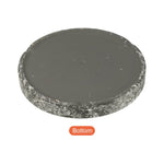 Underside view of round speckled ceramic saucer showing smooth bottom surface and textured rim