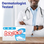 Box of Bounce Free & Gentle dryer sheets on a wooden surface with a doctor in a white coat blurred in the background and 'Dermatologist Tested' text
