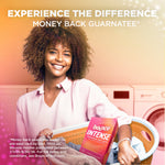 Smiling person holding a laundry basket with a box of Bounce Intense visible and 'Experience the Difference' money-back text above.