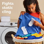 Woman holding a blue shirt and socks over a laundry basket with a washer in background and text about fighting static cling