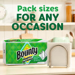 Bounty napkins pack on a countertop next to a napkin holder with bold 'Pack sizes for any occasion' text