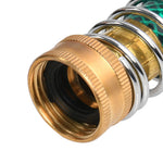 Tight macro of a brass female hose fitting showing internal rubber washer and surrounding chrome spring