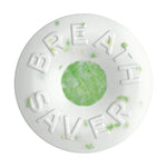 Close-up of a white Breath Savers mint with a green center and embossed "BREATH SAVER" lettering