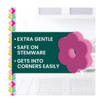 Pink flower-shaped Brite Blooms sponge with text callouts highlighting extra gentle and corner cleaning