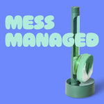 Brite dishwand standing in its matching round drain-and-dry stand with foam scrubber and 'MESS MANAGED' text