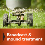 Close-up image of a broadcast spreader dispersing granules across lawn turf