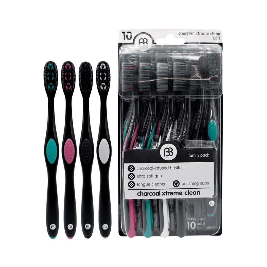 Packaged Brush Buddies family pack of black charcoal toothbrushes with colored grip accents and visible blister pack.