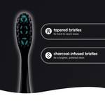 Close-up of a Brush Buddies charcoal toothbrush head showing tapered and charcoal-infused bristles with feature callouts.