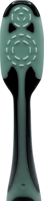 Textured mint-green tongue cleaner on the back of a Brush Buddies toothbrush handle shown in close-up