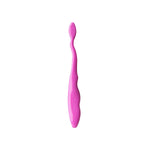 Single solid pink Brush Buddies toothbrush handle with textured cleaning surface and contoured grip
