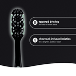 Single toothbrush head close-up with text highlighting tapered and charcoal-infused bristles