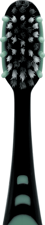 Close-up overhead view of a Brush Buddies toothbrush head with charcoal-infused bristles and green trim