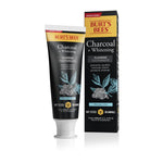 High‑resolution product shot of Burt's Bees Charcoal + Whitening toothpaste tube standing beside its rectangular box on white background