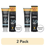 Two Burt's Bees Charcoal + Whitening toothpaste tubes and boxes shown as a 2-pack graphic with 'removes stains' callout