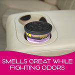 California Scents L.A. Lavender air freshener can sitting in a vehicle cup holder area on beige interior
