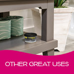 California Scents 'Ice' can displayed on a gray shelf in a bathroom-style scene next to packaged toilet paper.