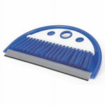 Blue Camco dust pan with attached whisk broom and rubber lip shown at a slight angle
