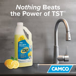 Camco TST bottle beside a kitchen faucet with slogan ‘Nothing Beats the Power of TST’