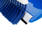 Close-up of blue whisk broom bristles resting inside a matching Camco dust pan
