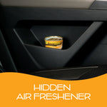 Small California Scents Hollywood Glow can tucked into a vehicle door pocket above an orange panel reading Hidden Air Freshener.