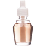 Clear glass refill bottle filled with pale caramel-colored fragrance oil and a white screw cap on a white background