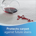 Close-up of spilled red liquid on carpet with a tipped glass and text overlay reading 'Protects carpet against future stains'.