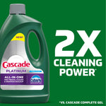 Close-up of Cascade Platinum bottle left with large text on green background declaring 2X cleaning power