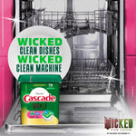 Cascade Wicked for Good tub placed in front of an open stainless steel dishwasher with bold green copy about cleaning