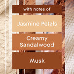 Text panel listing fragrance notes: jasmine petals, creamy sandalwood, and musk over a textured wood background