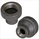 Two views of a black cast-iron hex reducing coupling showing threaded interiors and the textured exterior surface.