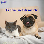 A gray-and-white cat and a fawn pug lying together on a blanket with overlay text 'Fur has met its match' and Suavitel logo