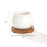 Single white jar-shaped ceramic pot shown on a round bamboo saucer with dimensional measurement lines indicating height and width