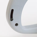 Cropped close-up of the gray plastic handle of a Chapin spreader showing a slot and circular hole detail.