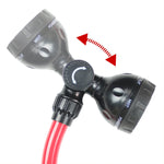 Close-up of dual-head adjustable spray nozzle with rotation indicator and red arrow showing pivot action