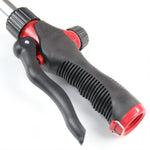 Detailed view of the black textured pistol grip and curved trigger on a Chapin watering wand, with red accent pieces.