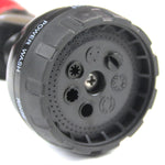 Macro view of black multi-pattern spray face showing several nozzle holes and labeled spray settings