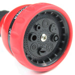 Close-up of red multi-pattern spray head showing multiple nozzle openings and a black selector ring on a Chapin wand.