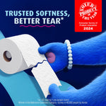 Close-up of Charmin bear tearing a roll of Charmin Ultra Soft toilet paper with 'Trusted softness, better tear' text