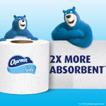 Charmin blue bears beside a close-up toilet paper roll and large text stating “2X more absorbent” on a light blue background.