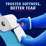 Blue furry hand tearing embossed Charmin Ultra Soft toilet paper with headline 'Trusted Softness, Better Tear'