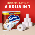Charmin Mega XL pack staged with loose toilet rolls and stacked rolls under headline 'LONGER LASTING 6 ROLLS IN 1'