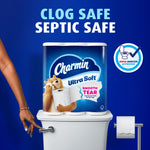 Charmin Ultra Soft pack placed on a toilet tank with 'clog safe septic safe' claim and Roto-Rooter approved badge