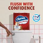 Charmin Ultra Strong multipack positioned on a toilet tank with slogan 'Flush With Confidence' and Roto-Rooter approved badge