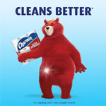 Red Charmin bear holding Charmin Ultra Strong packaging beneath a headline that reads “Cleans Better”