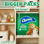 Charmin Ultra Gentle mega pack displayed inside bathroom shelving with 'bigger packs' headline