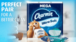 Charmin Ultra Soft mega pack displayed with folded towels and a pack of Charmin wipes in a staged bathroom scene