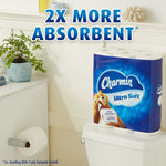 Charmin Ultra Soft pack placed on a toilet tank in a bathroom setting with text '2X MORE ABSORBENT' above