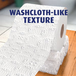 Close-up roll of Charmin Ultra Strong toilet paper showing textured, washcloth-like embossing
