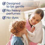 Smiling adult and child holding a towel with checklist text: 'Designed to be gentle, No heavy perfumes, No dyes'.